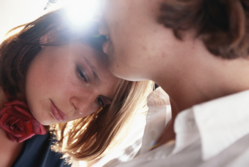 Young couple embracing, close-up