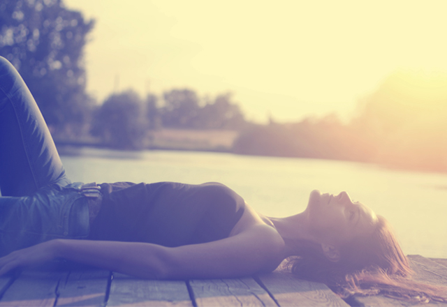 Vintage photo of relaxing young woman in nature